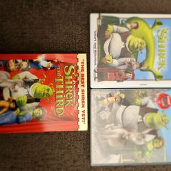 Dvds, 3 of the Shrek series, new, giftable $10.00 set of 3