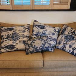 3 Couch Throw Pillows And A Single Pillow