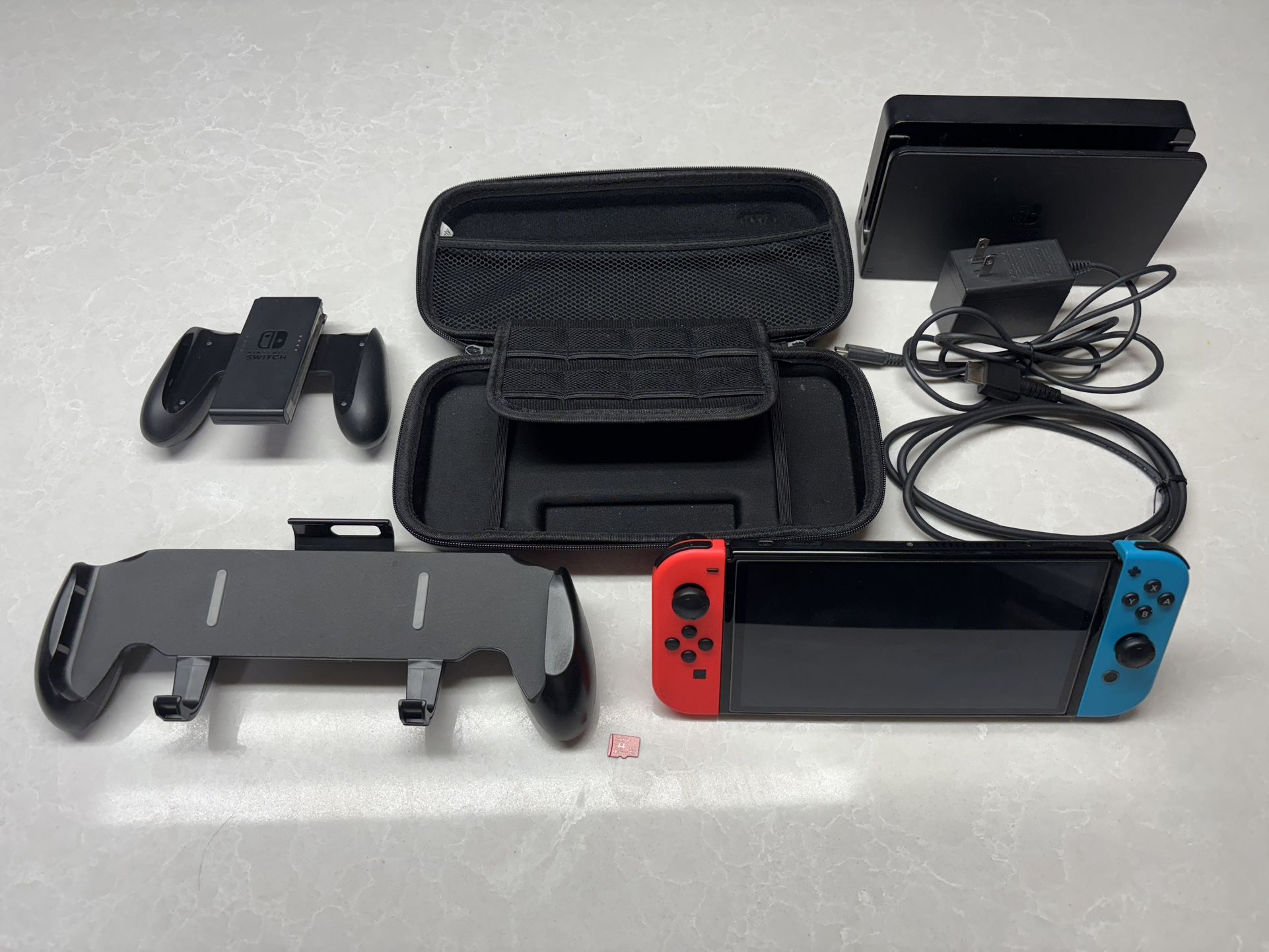 Nintendo Switch OLED Console Bundle – Red/Blue Joy-Con, Dock, Grips, Case, & 128GB microSD