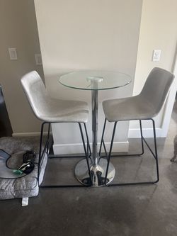 Glass cocktail table and bar seats