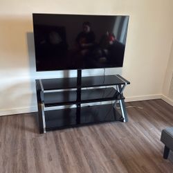 Pivoting Tv Stand And 55’ TV