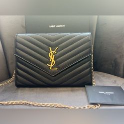 Black YSL Cassandre Wristlet Clutch