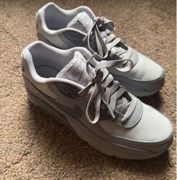 Gray boy Nike shoes