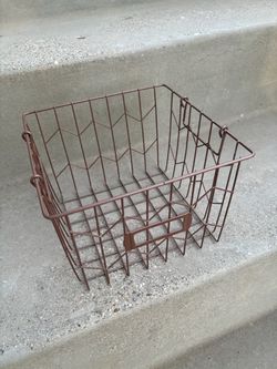 bronze-colored metal wire storage basket featuring an integrated label holder on the front.