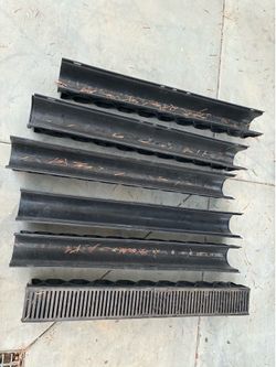 Metal trough drains