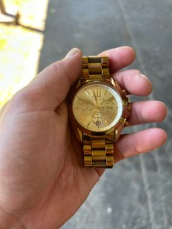 Men’s gold Michael Kors watch