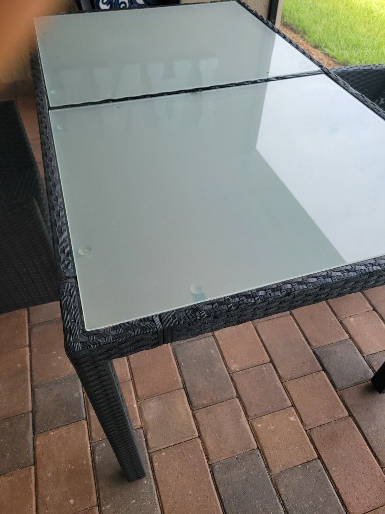 59"×36" table glass and Wicker mint condition q year old used inside lanai paid $699 plus tax(no chairs) reduced