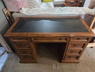 Wooden executive desk with 7 drawers and leather top, bottom drawers can be used as file cabinets