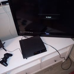 Tv And Ps3 With Controller And 4 Games 