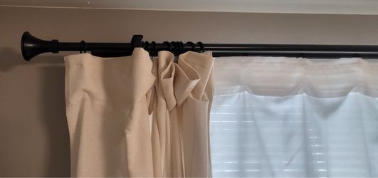 Blackout drapes pole and sheers.