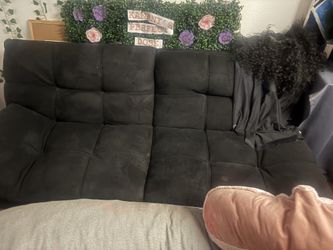 Black futon with adjustable arms