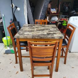 Table and four chairs