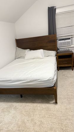 Queen Bed with covered mattress