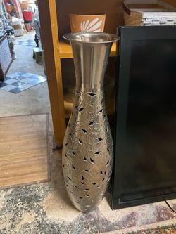 Tall metal vase