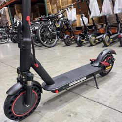 Front and rear shock-absorbing electric scooters