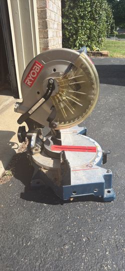 Ryobi 10-inch compound miter saw model TS1340. Needs dust bag. Dirty & has scratches from use see pics