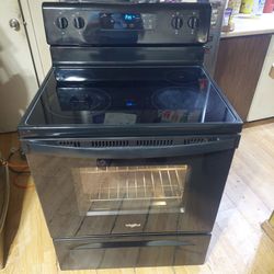 5 yr old Whirlpool 4 Burner glass top stove works excellent