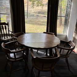 Antique dining table with five chairs