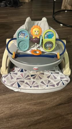 Baby sit me up  seat . Fabric is washable . Also folds down for storage .