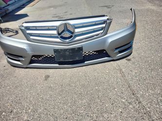 2011-2014 Mercedes C250/300 complete front bumper with all the accessories and grill with emblem OEM.