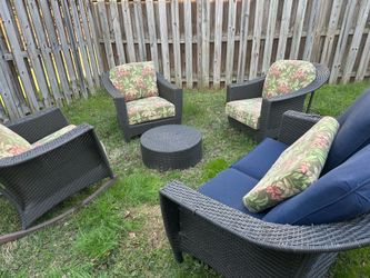 Wicker outdoor furniture set or individual pieces. Includes washable cushions.