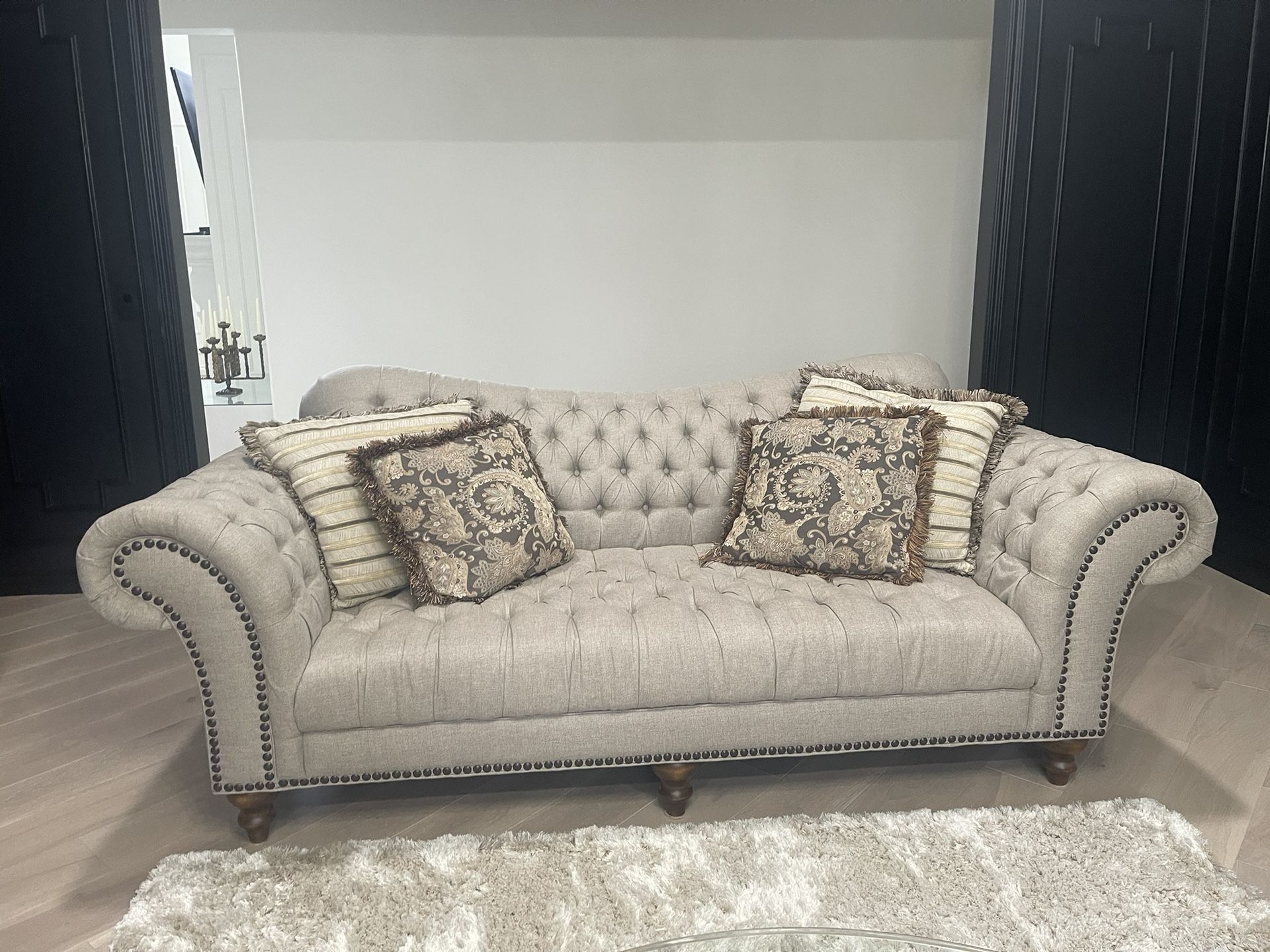 2 large tufted sofas in like new condition