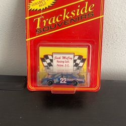 The product is a "Trackside Souvenirs" die-cast model car, specifically a NASCAR