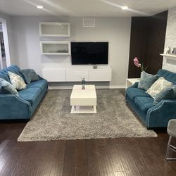 Blue Couches And White Tables Set