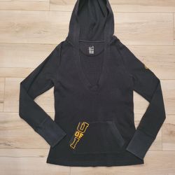 The NCAA Iowa Hawkeyes Logo Girls Thermal Long Sleeve hoodie.  This good condition used hoodie is a Youth Large (12-14) and is in great ready to wear 