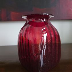 Large hand-blown ruby red swirl glass vase with pontil mark.