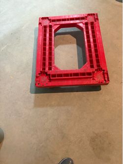 Red plastic dolly base