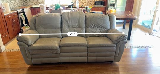 Leather reclining sofa with heat and massage