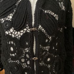 A Black Crochet Cardigan With Irish Lace Is Very Elegantly 