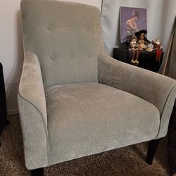 Green upholstered wood accent chair