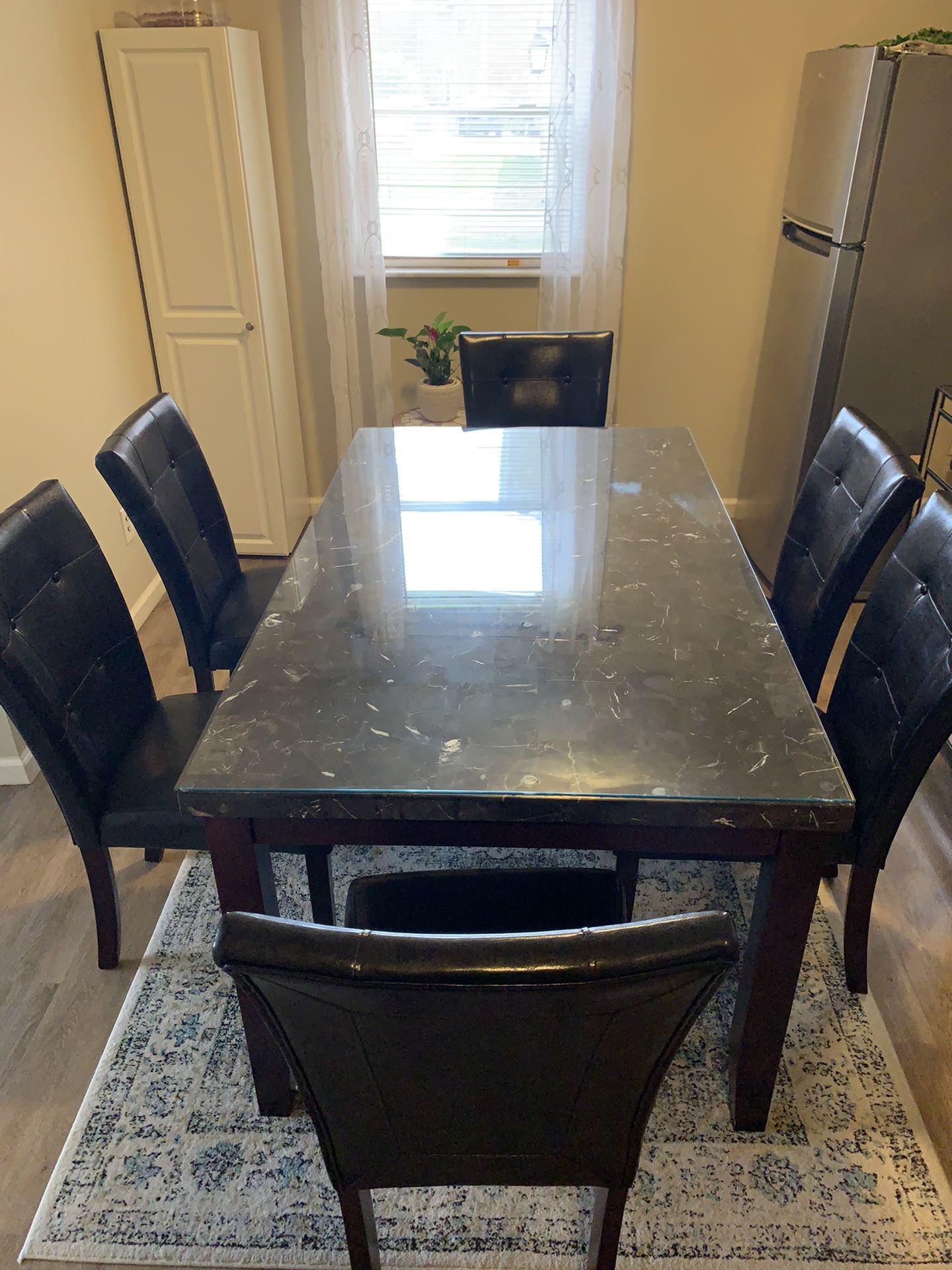 Dining room table, and 6 chairs + glass!