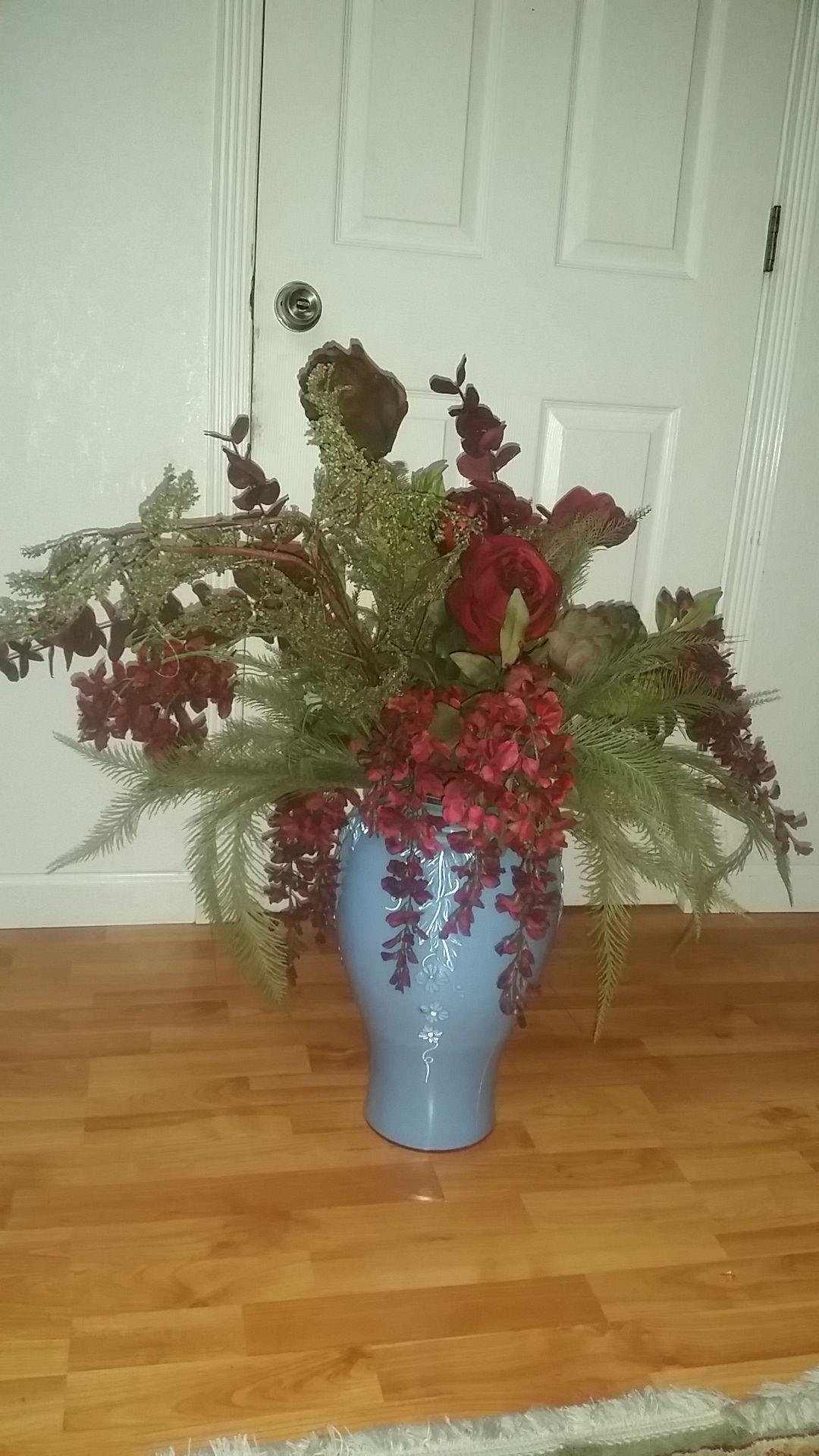 Gorgeous blue vase with flowers