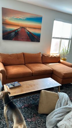 Orange 9 foot couch with chase