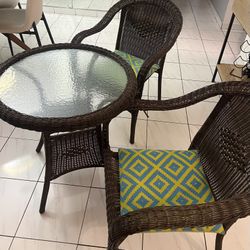 Three-Piece Brown Rattan/Wicker Patio Set with Round Table & Geometric Cushions