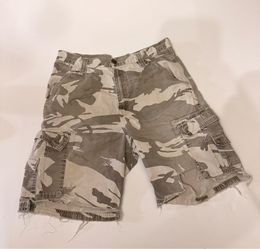 Vintage Authentic Wrangler Camouflage cargo shorts with a distressing and frayed raw hem