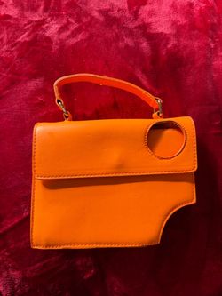 orange crossbody bag with a top handle