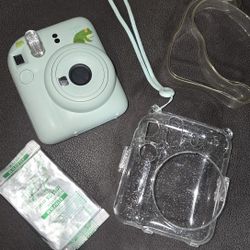 mint green 12 Polaroid camera with new refill, case and strap