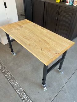 Adjustable height work bench (47” x 23.5”)