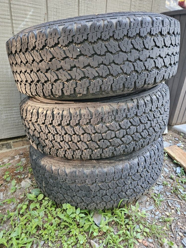 3 Goodyear Wrangler Kevlar Tires On 7 Lug Ford Rims 245/75R16