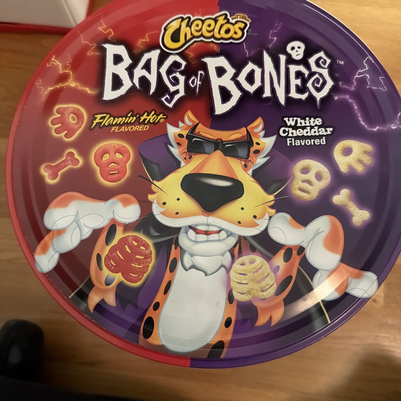 Empty limited edition tin of Cheetos Bag of Bones