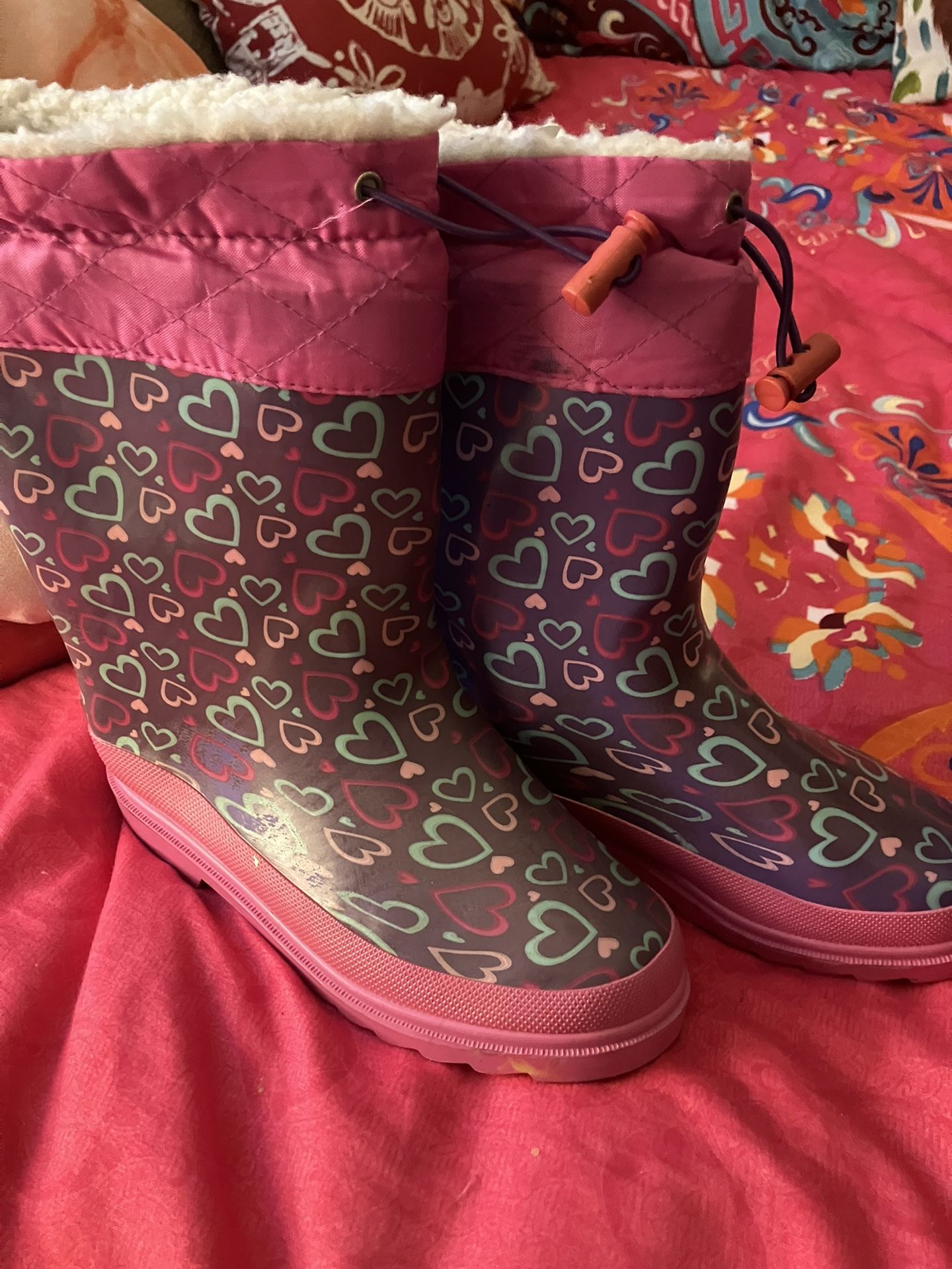 Young girl, rain boots size 2, and three