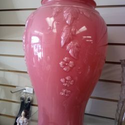 molded glass floor vase, potentially an American-made coral pink baluster-shaped piece featuring relief decoration with floral motifs. 