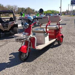 Three-wheeled mini scooter $1,995 cash price plus taxes.