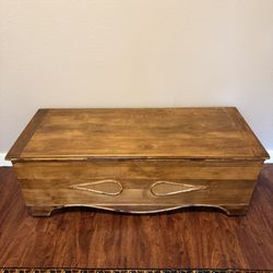 Old Trunk On Wooden Wheels