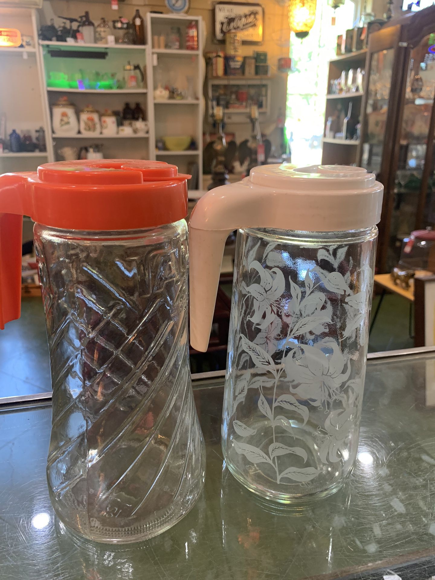 1960s1970s TANG PITCHERS. 14.00 each.  Johanna at Antiques and More. Located at 316b Main Street Buda. Antiques vintage retro furniture collectibles m