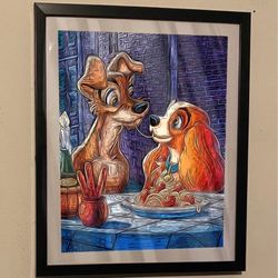 I have this custom art piece of lady and the tramp on a piece 12x10 black picture frame that would look good in any home or office wall it and it woul